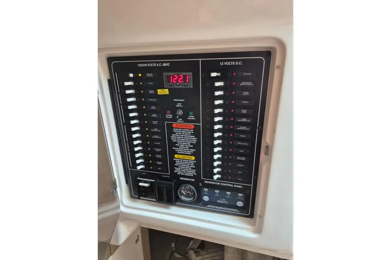 Slide: The Image of Electrical control panel on a 2018 Grady-White Express 330 boat. - 71