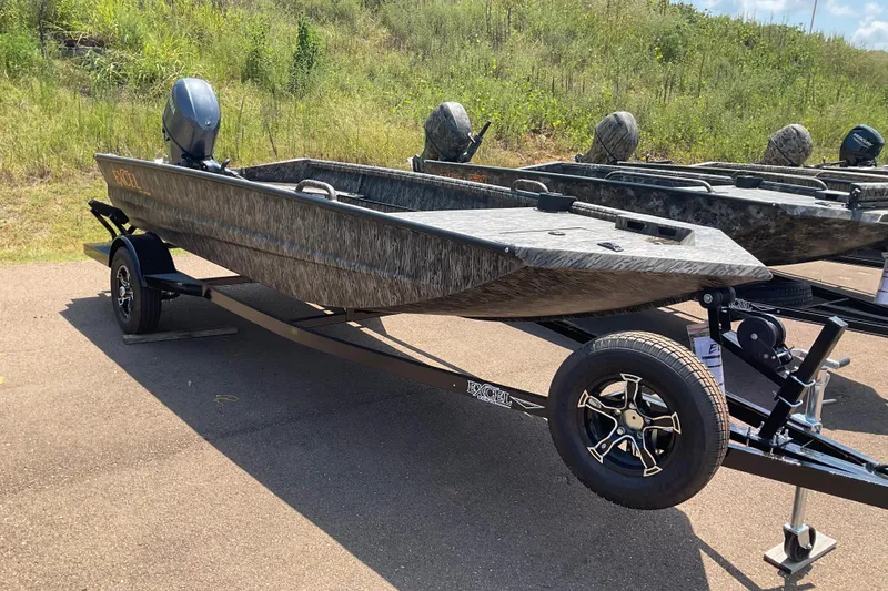 The Image of 2026 Excel 1754 Eclipse boat on trailer, parked outdoors on a sunny day. - 0