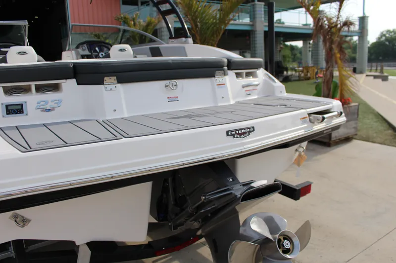 Slide: The Image of 2022 Chaparral 23 SSi boat rear view with swim platform and propeller. - 12