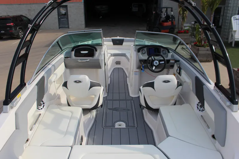 Slide: The Image of 2022 Chaparral 23 SSi boat interior with modern seating and steering console. - 4