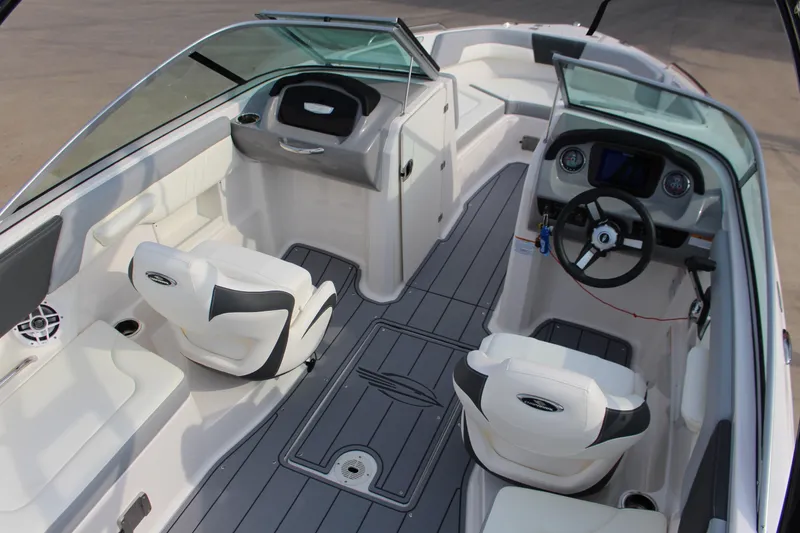 Slide: The Image of 2022 Chaparral 23 SSi boat interior with modern seating and dashboard design. - 5