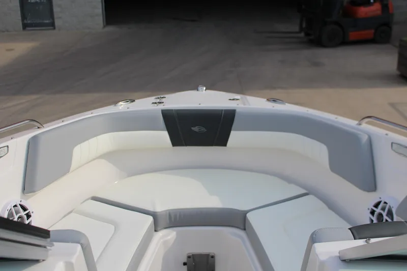 Slide: The Image of 2022 Chaparral 23 SSi boat interior with gray and white seating. - 8