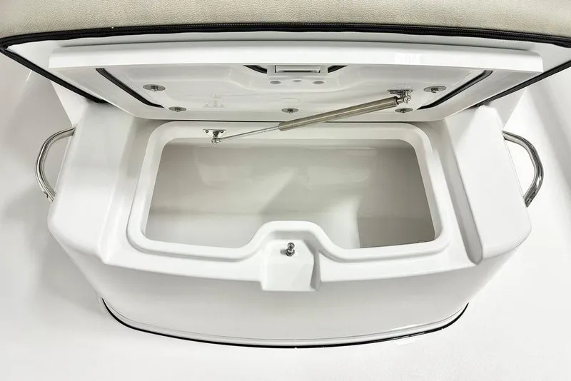 Slide: The Image of Open storage compartment on 2025 Sportsman Open 302 boat, featuring stainless steel handles. - 2
