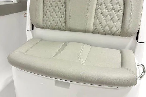 Slide: The Image of 2025 Sportsman Open 302 boat seat with diamond-stitched upholstery, light gray color. - 3