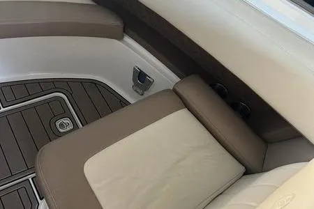 Slide: The Image of 2009 Cobalt 296 boat named "Our Great Escape" docked on a sunny day. - 8