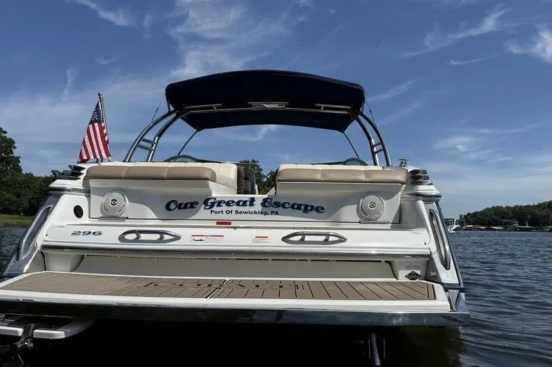 Slide: The Image of 2009 Cobalt 296 boat interior with beige and white leather seating. - 9