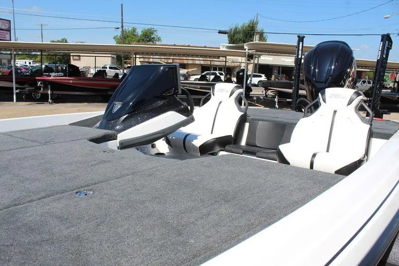 Slide: The Image of 2026 Skeeter ZXE20 boat with dual seats and sleek design in a showroom setting. - 11