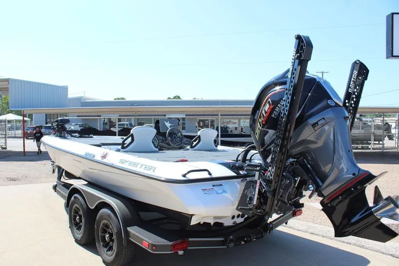 Slide: The Image of 2026 Skeeter ZXE20 boat on trailer, featuring powerful engine and sleek design. - 2