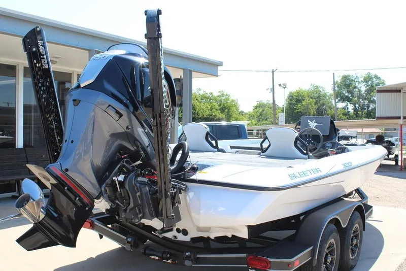 Slide: The Image of 2026 Skeeter ZXE20 boat on trailer, featuring powerful outboard motor and sleek design. - 3