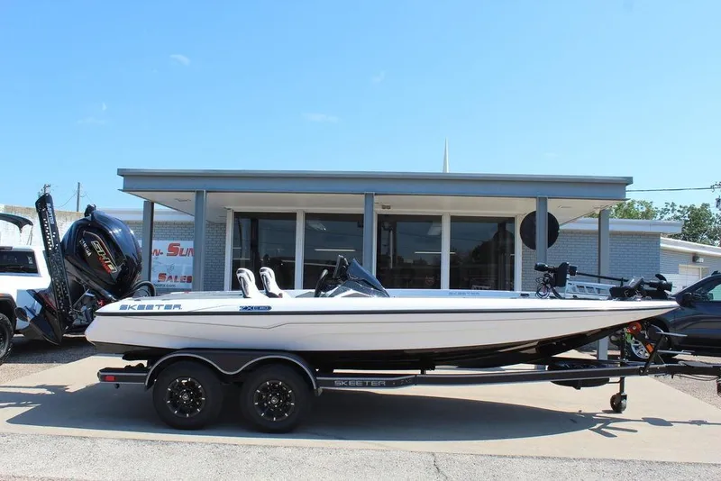 Slide: The Image of 2026 Skeeter ZXE20 boat on trailer outside dealership, side view. - 4