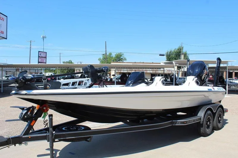 Slide: The Image of 2026 Skeeter ZXE20 boat on trailer, displayed outdoors under clear blue sky. - 5