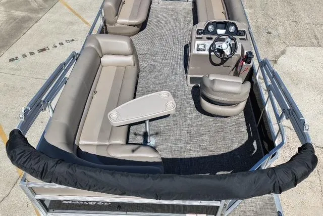 Slide: The Image of 2024 Ranger RP200C pontoon boat interior with seating and steering console. - 3