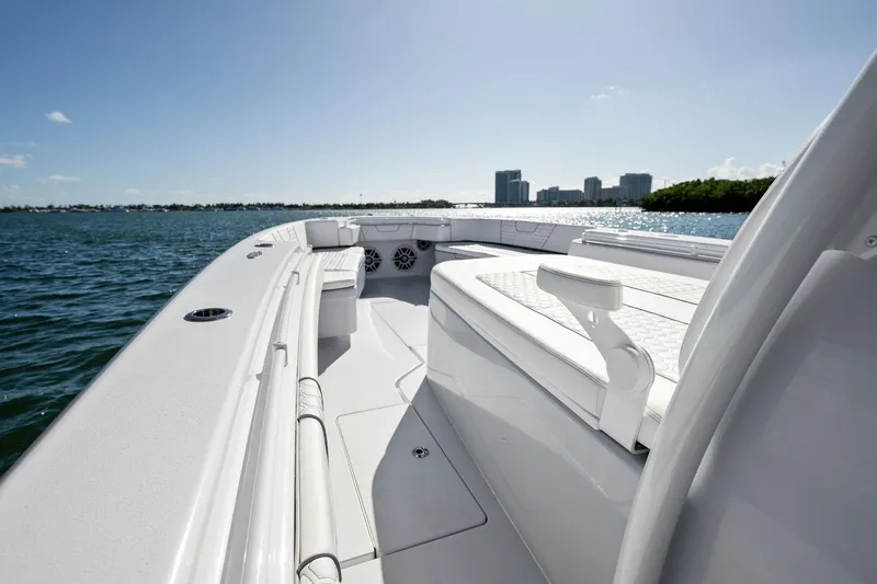 Slide: The Image of 2026 Contender 44 CB boat on water, city skyline in background. - 13