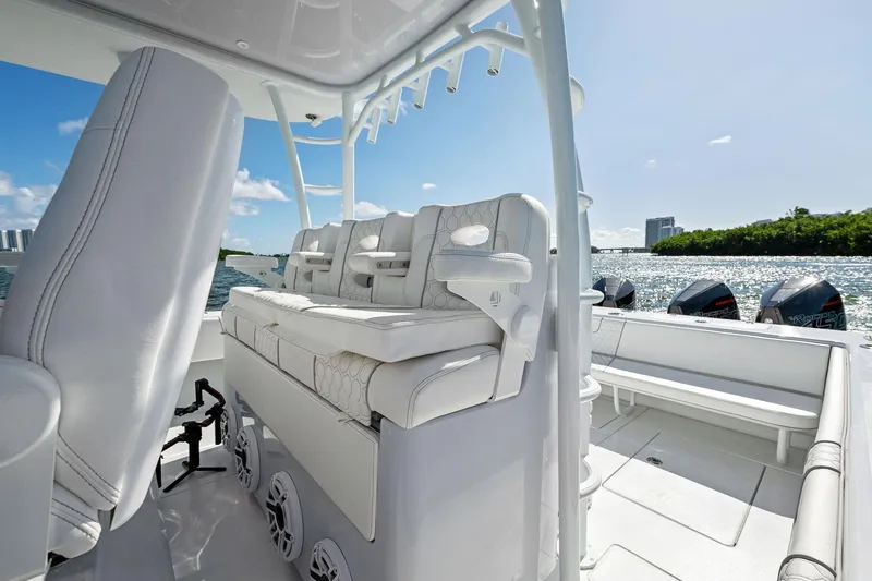 Slide: The Image of 2026 Contender 44 CB boat interior with luxurious seating and multiple outboard engines. - 18