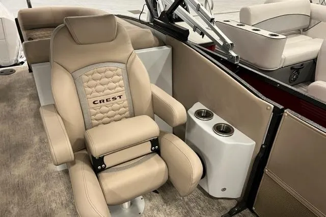Slide: The Image of Luxurious seating on 2022 Crest Savannah 250 SLC pontoon boat with cup holders. - 3