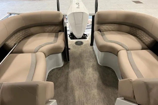 Slide: The Image of 2022 Crest Savannah 250 SLC boat interior with beige seating and modern design. - 7