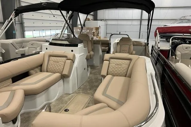 Slide: The Image of 2022 Crest Savannah 250 SLC boat interior with luxurious beige seating and modern design. - 8