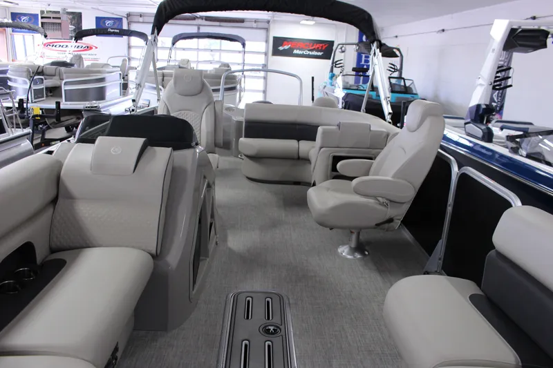 Slide: The Image of 2022 Premier 230 Explorer pontoon boat interior with luxurious seating and modern design. - 17