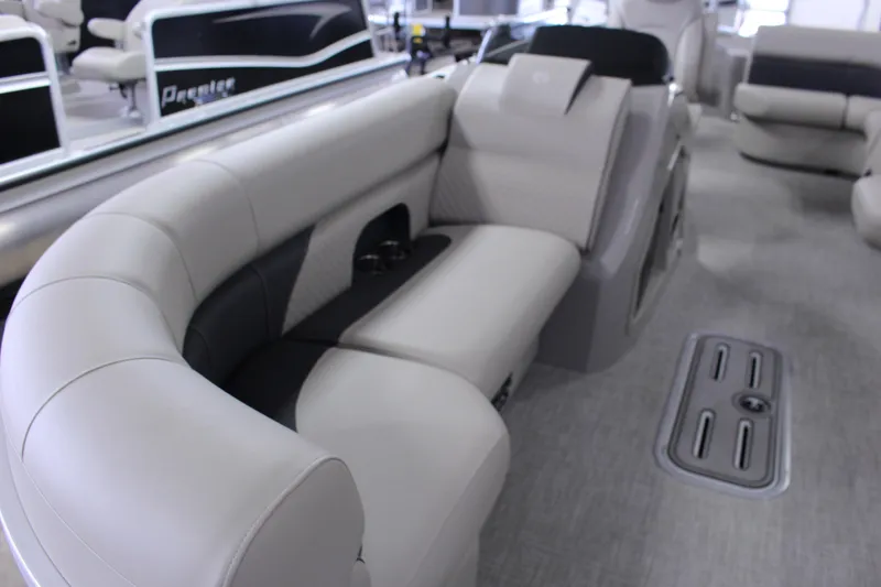 Slide: The Image of Luxurious seating on 2022 Premier 230 Explorer pontoon boat, featuring elegant design and comfort. - 18
