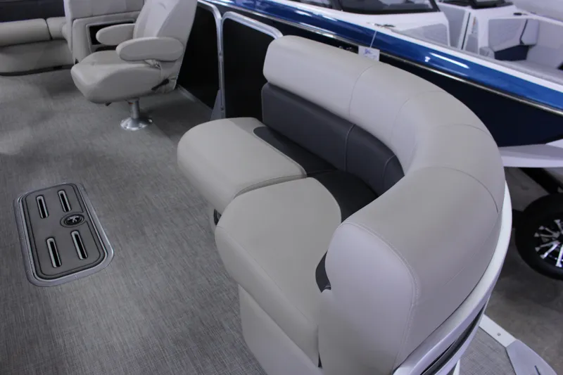 Slide: The Image of 2022 Premier 230 Explorer boat interior with plush seating and modern design. - 19
