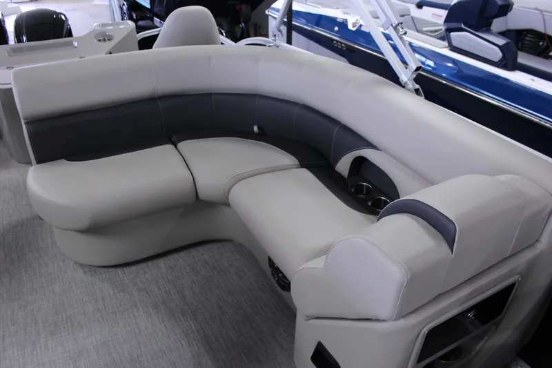 Slide: The Image of Luxurious seating on 2022 Premier 230 Explorer boat, featuring plush gray upholstery. - 22