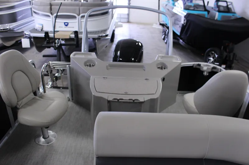 Slide: The Image of Interior of 2022 Premier 230 Explorer pontoon boat with seating and control console. - 23
