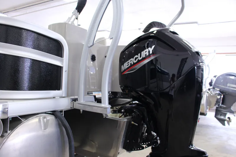 Slide: The Image of 2022 Premier 230 Explorer with Mercury outboard motor in showroom. - 6