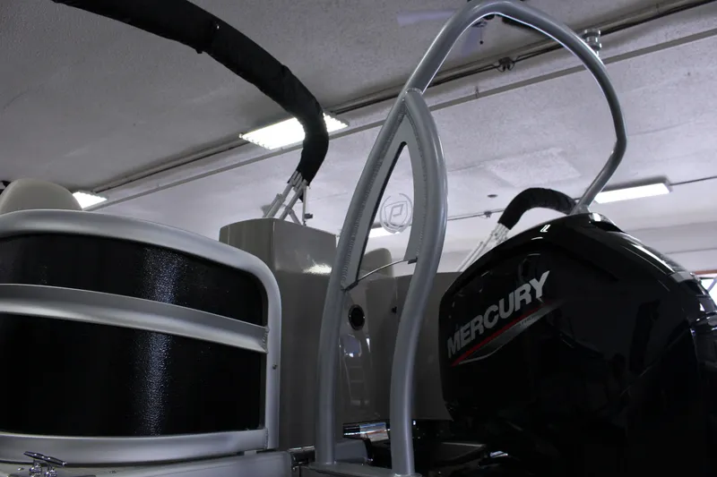 Slide: The Image of 2022 Premier 230 Explorer boat with Mercury engine in a garage setting. - 7