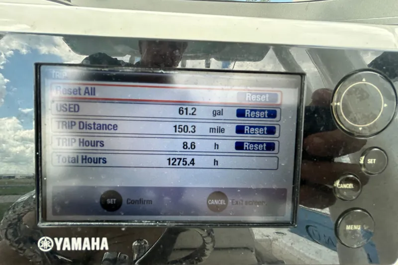 Slide: The Image of Yamaha display showing trip data: 61.2 gallons used, 150.3 miles, 8.6 hours, 1275.4 total hours. - 21