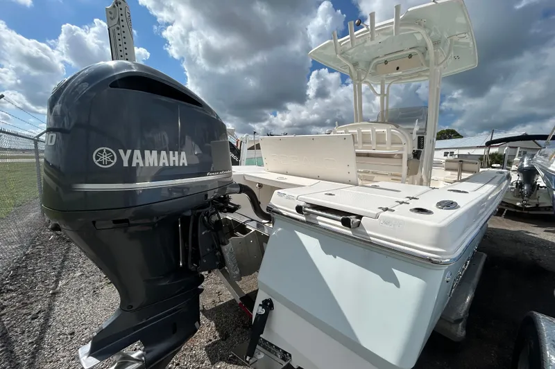 Slide: The Image of 2016 Robalo 246 Cayman boat with Yamaha outboard motor under cloudy sky. - 6
