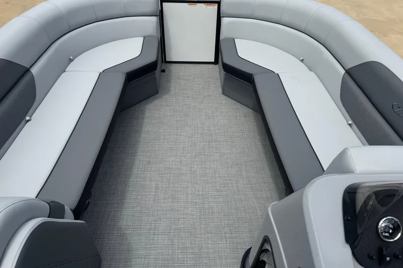 Slide: The Image of 2025 Veranda Vista Sport VS 22 RC boat interior with gray seating and carpet flooring. - 10