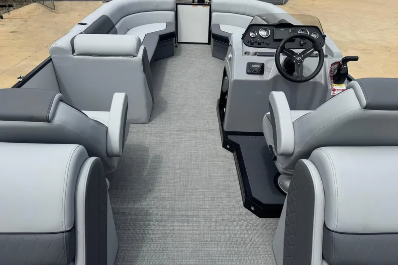 Slide: The Image of 2025 Veranda Vista Sport VS 22 RC pontoon boat interior with gray seating and modern dashboard. - 7