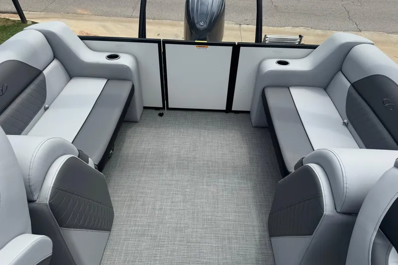 Slide: The Image of 2025 Veranda Vista Sport VS 22 RC interior with gray seating and carpeted flooring. - 8