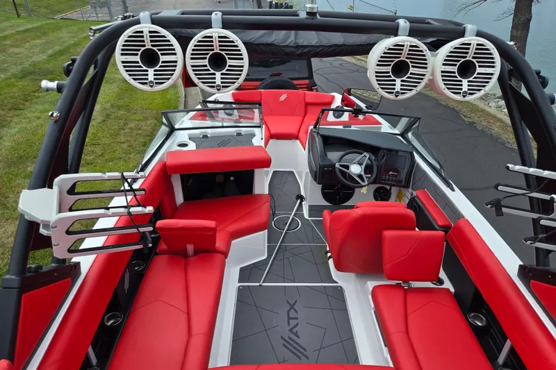 Slide: The Image of 2022 ATX Surf Boats 20 Type-S interior with red seating and advanced audio system. - 13