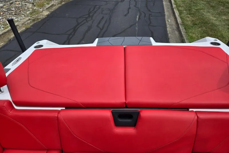 Slide: The Image of 2022 ATX Surf Boats 20 Type-S with vibrant red seating on a paved road. - 22