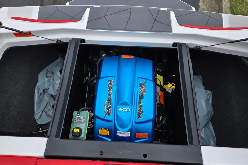 Slide: The Image of 2022 ATX Surf Boats 20 Type-S engine compartment with Raptor 400 engine. - 24