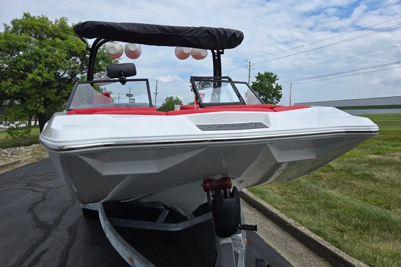 Slide: The Image of 2022 ATX Surf Boats 20 Type-S on trailer, featuring sleek design and red interior accents. - 6