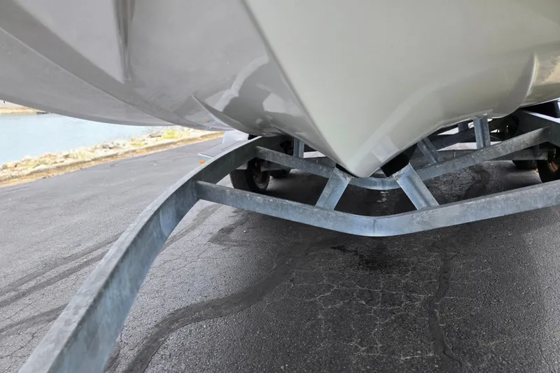 Slide: The Image of 2022 ATX Surf Boats 20 Type-S on a trailer, close-up view of hull and frame. - 7