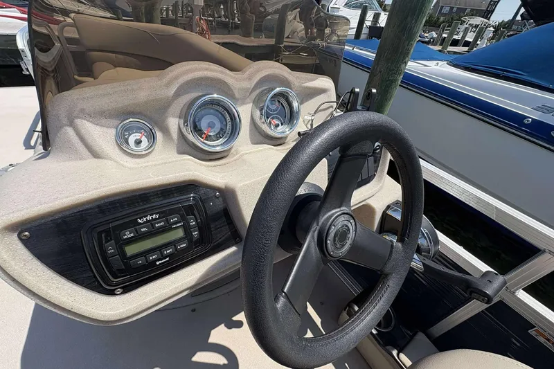 Slide: The Image of Steering console of 2018 Avalon GS 2185 CR boat with gauges and audio system. - 12