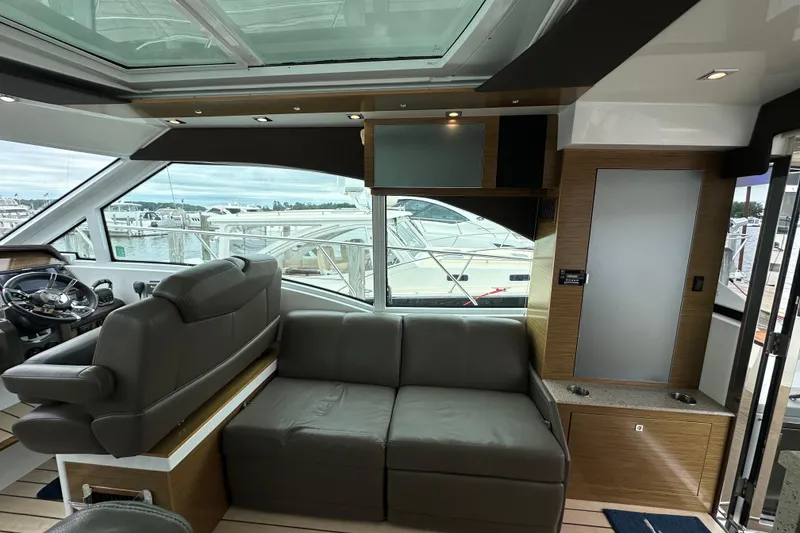 Slide: The Image of Interior of 2013 Cruisers Yachts 45 Cantius with leather seating and panoramic windows. - 14