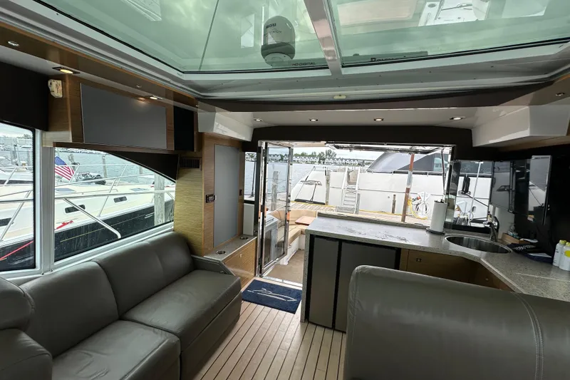 Slide: The Image of Interior of 2013 Cruisers Yachts 45 Cantius with modern design and spacious seating area. - 15