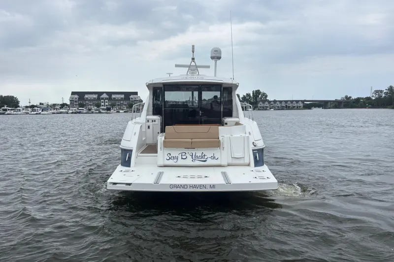 Slide: The Image of 2013 Cruisers Yachts 45 Cantius on water, rear view, Grand Haven, MI. - 2