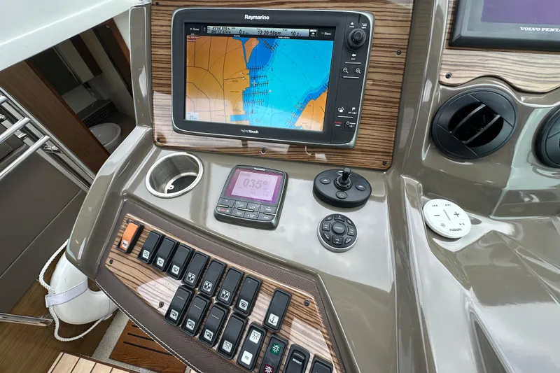 Slide: The Image of Control panel of 2013 Cruisers Yachts 45 Cantius with navigation and control systems. - 21