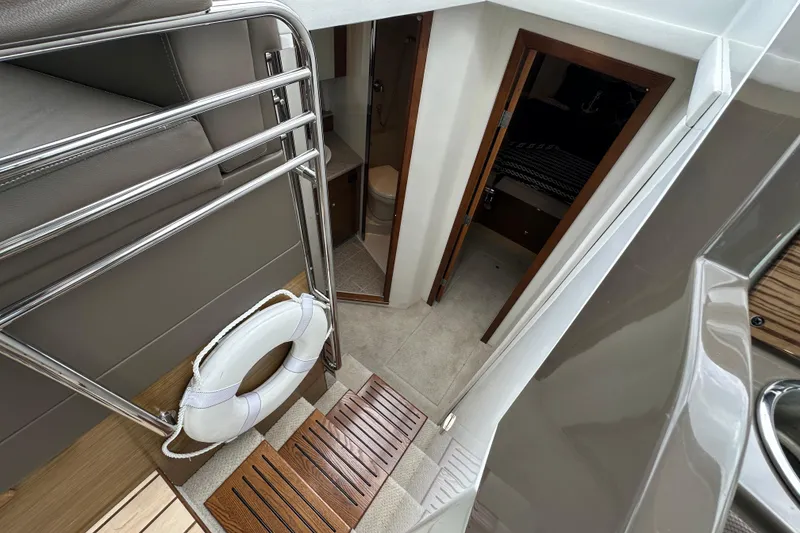 Slide: The Image of Interior view of 2013 Cruisers Yachts 45 Cantius, featuring stairs and cabin entrance. - 23