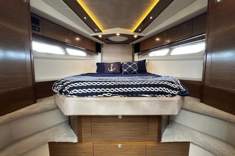 Slide: The Image of Luxurious cabin interior of 2013 Cruisers Yachts 45 Cantius with elegant bedding and ambient lighting. - 24
