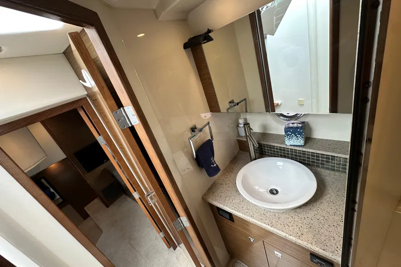 Slide: The Image of Luxurious bathroom interior of 2013 Cruisers Yachts 45 Cantius with modern sink and mirror. - 32