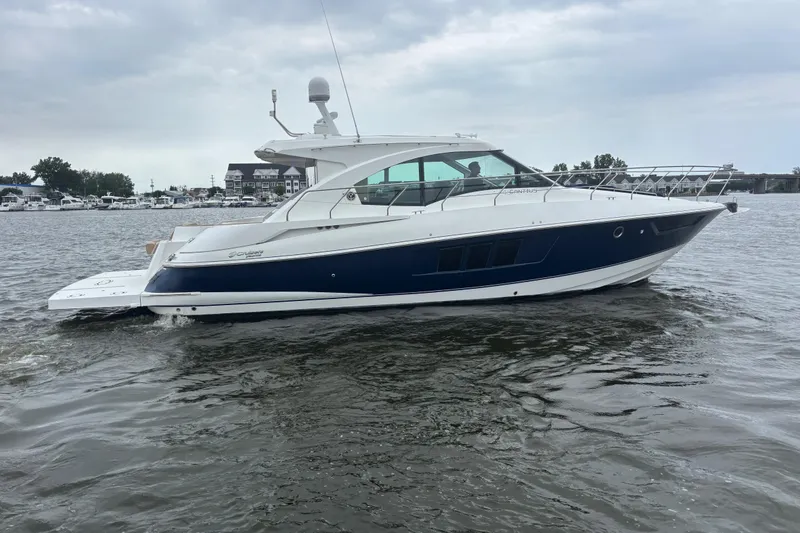 Slide: The Image of 2013 Cruisers Yachts 45 Cantius on water, sleek design, overcast sky. - 1