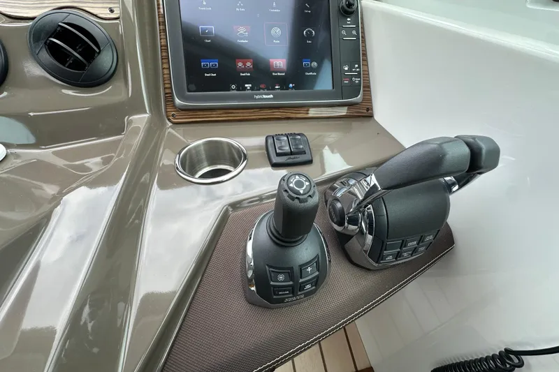 Slide: The Image of Control panel of 2013 Cruisers Yachts 45 Cantius with joystick and throttle. - 20
