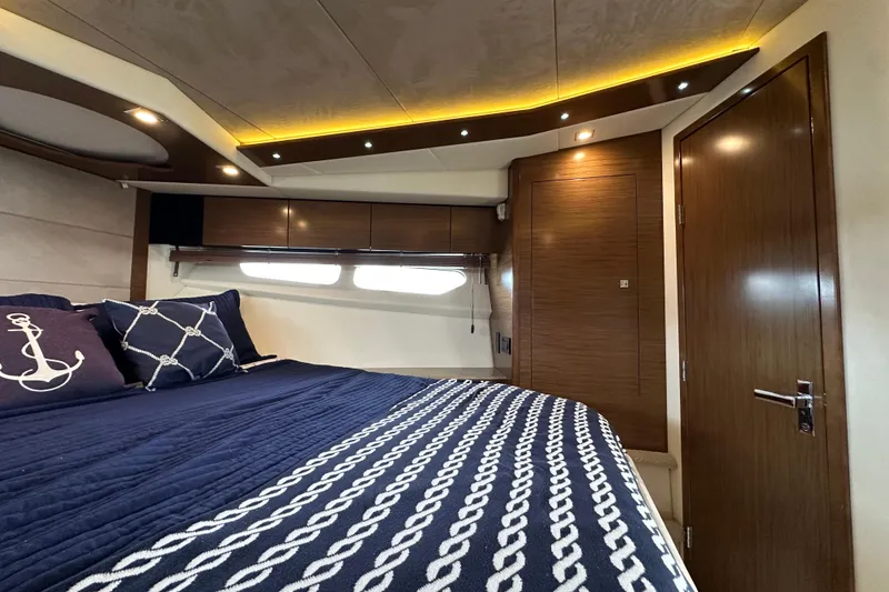 Slide: The Image of Luxurious bedroom interior of 2013 Cruisers Yachts 45 Cantius with nautical-themed decor. - 25