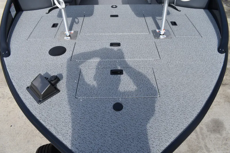 Slide: The Image of 2026 Lowe Sport Deck 224 boat deck with storage compartments and fishing rod holders. - 12